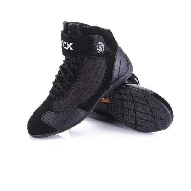 Pair of durable adventure motorcycle boots, gray and black, designed for all-season off-road riding.