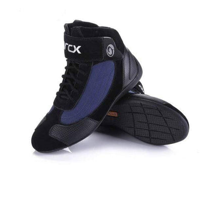 Adventure riding gear: high-cut motorcycle boots with multiple buckles for secure off-road use.