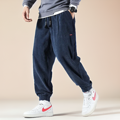 Cozy unisex gray corduroy lounge pants, perfect for relaxing or stylish everyday casual wear.