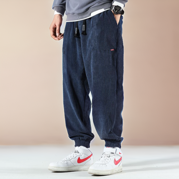 Stylish black corduroy joggers for men & women, offering a relaxed fit for active comfort & casual wear.