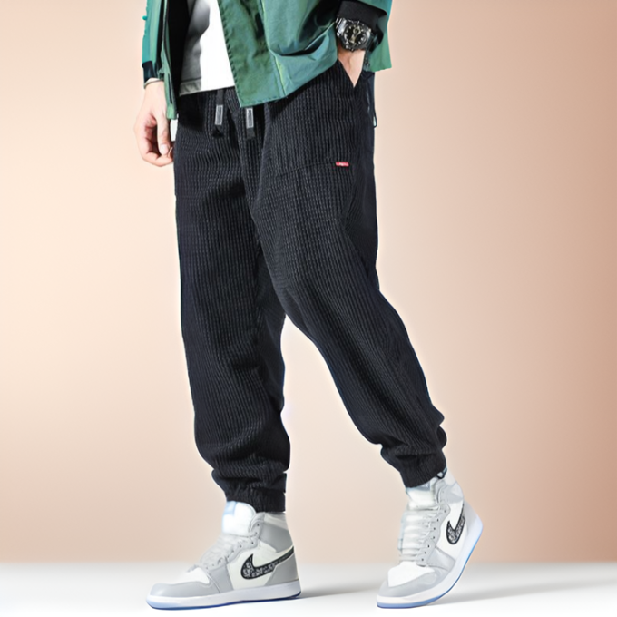 Gray unisex Oslo corduroy sweatpants, combining ultimate comfort with a stylish relaxed fit for casual wear.