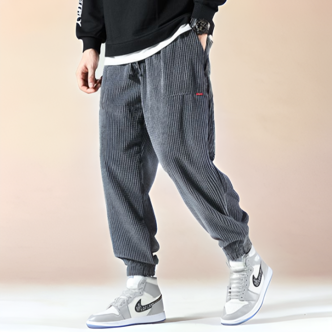 Black unisex Oslo corduroy sweatpants, relaxed fit, blending modern style with ultimate cozy comfort.