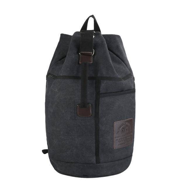 Close-up of a sturdy canvas hiking backpack with leather accents and secure drawstring closure.
