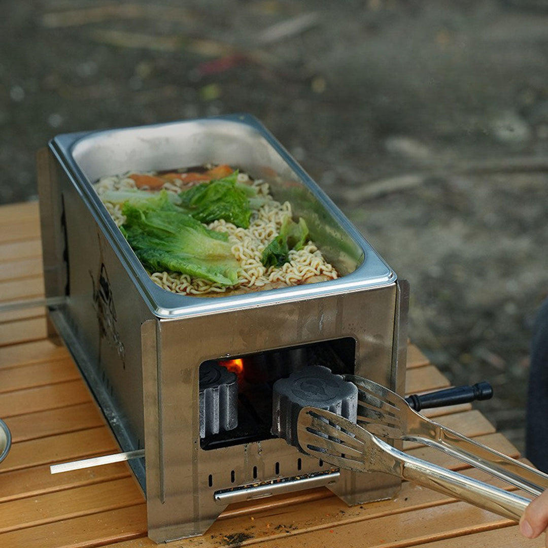 Outdoor charcoal grill and stove with robust design, perfect for camping trips.