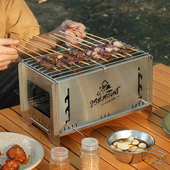 Versatile camp cooking system: charcoal grill, stove, and mini fire pit.