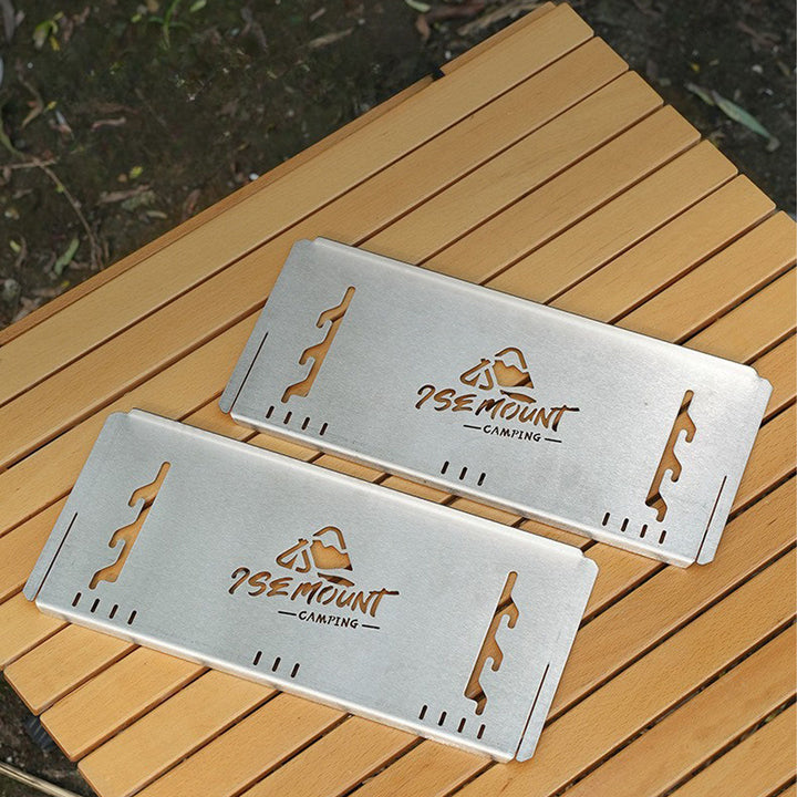 Stainless steel portable outdoor charcoal grill and stove for easy transport.