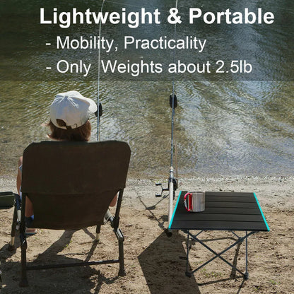 Portable folding camping table, lightweight and compact, perfect for outdoor enthusiasts and travel.