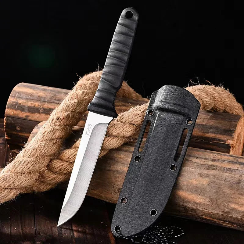 Tactical survival knife with a secure neck sheath, perfect for mountaineering, camping, and outdoor adventures.