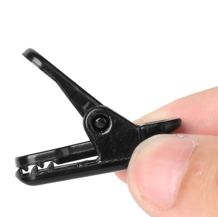 Close-up of WindGrip Tent Clip, durable outdoor accessory for wind resistant tent setup