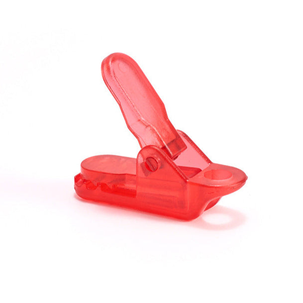 Unisex WindGrip Tent Clip Set displayed next to a folded tent, emphasizing portability