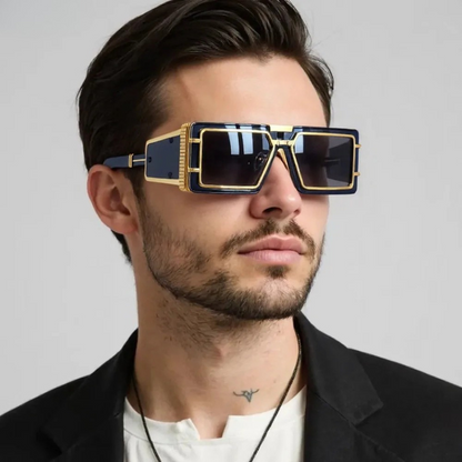 Unisex oversized geometric sunglasses with gold details. High-fashion eyewear offering UV protection.