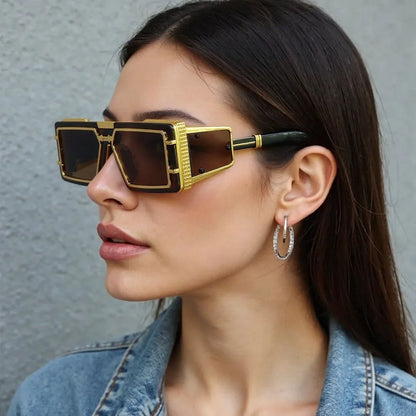 Geometric sunglasses featuring stylish gold details. Unisex, oversized, fashion-forward eyewear with UV protection.
