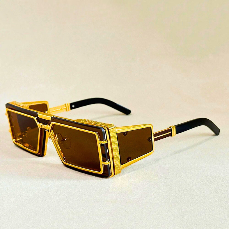 Oversized geometric shades with chic gold detail. Unisex fashion sunglasses providing essential UV protection.
