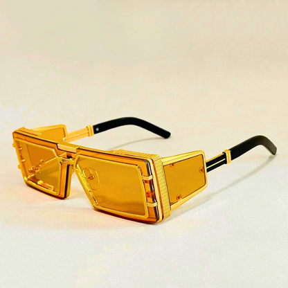 Statement geometric eyewear for unisex fashion. Oversized shades with elegant gold details and UV protection.
