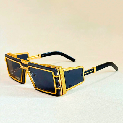 Modern geometric unisex sunglasses. High-fashion, oversized shades with gold accents & crucial UV protection.