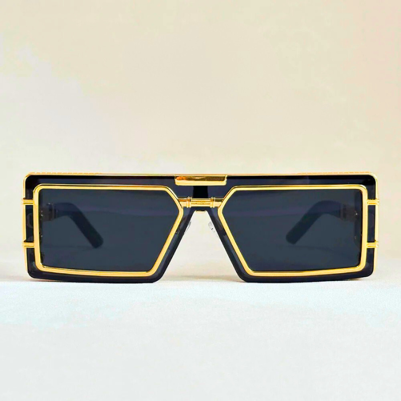 Stylish geometric unisex sunglasses. Oversized fashion shades featuring gold details and full UV protection.