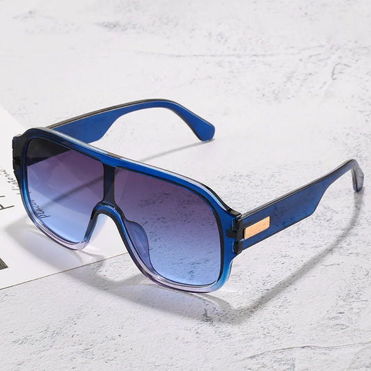 Unisex oversized gradient lens sunglasses, a stylish and modern eyewear accessory.