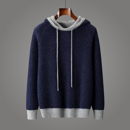 Cozy oversized knit hoodie with stylish contrast trim, a relaxed fit for unisex everyday comfort & style.