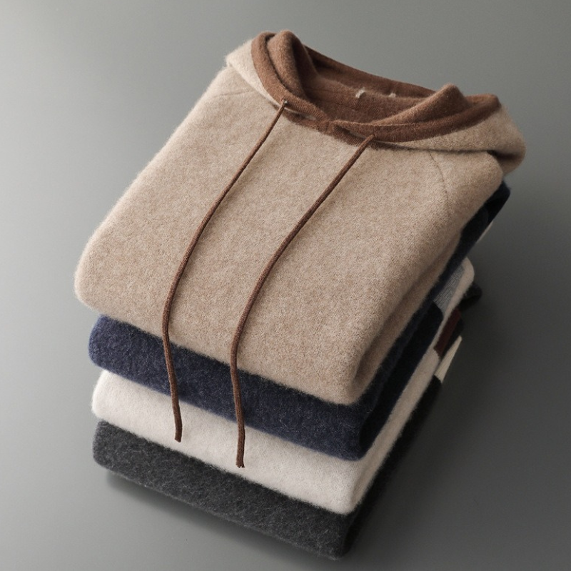 Warm, cozy oversized knit hoodie for unisex comfort, perfect for chilly fall and winter days. Casual style.
