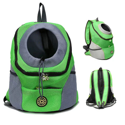 Happy small dog looking out from a portable pet carrier backpack, ready for outdoor travel & adventures.