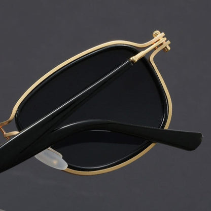 Unisex polarized sunglasses with a sleek, lightweight metal frame; offers full UV protection and anti-glare.