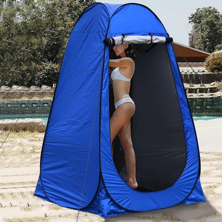 Unisex pop-up portable privacy shower tent for camping, front view, in a forest setting