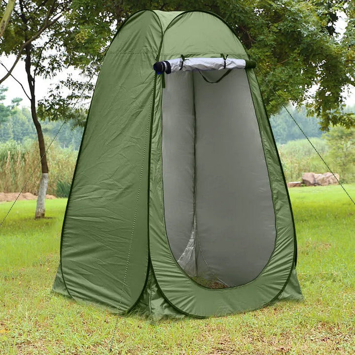 Pop-up shelter for camping, beach, or events, side view illustrating stability, green color