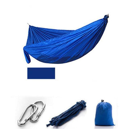 Hiking gear essential: a camping hammock with mosquito netting, packed for an outdoor adventure.