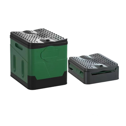 Portable foldable camping toilet next to a tent, showcasing outdoor use in a natural setting