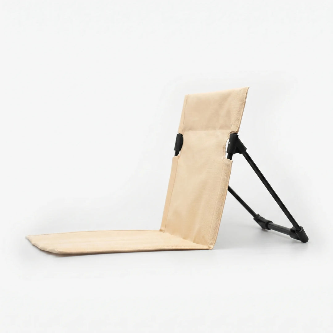 Compact portable picnic chair, a folding floor seat designed for easy transport and comfortable outdoor dining.