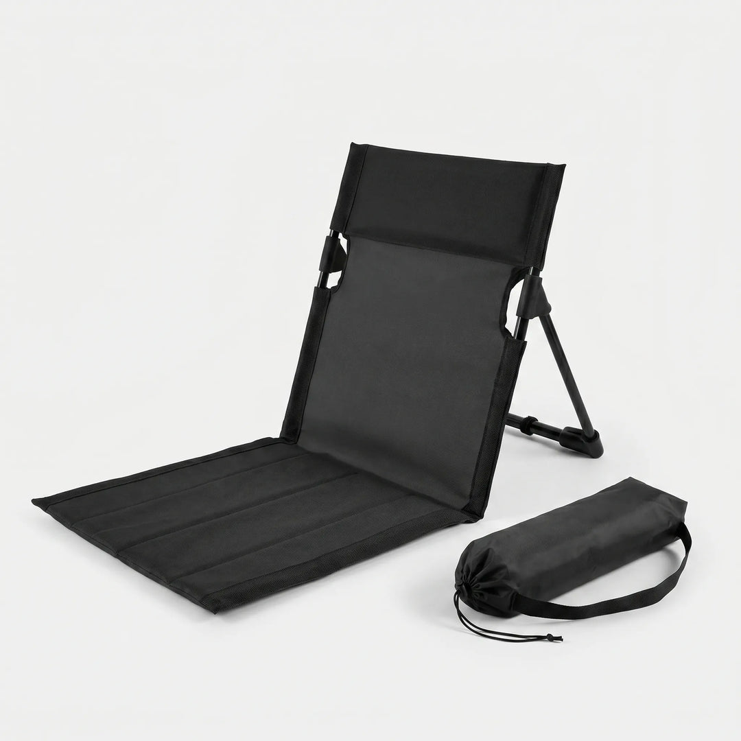 Compact folding ground chair, great for concerts or sports. Unisex portable outdoor seat for comfy stadium viewing.