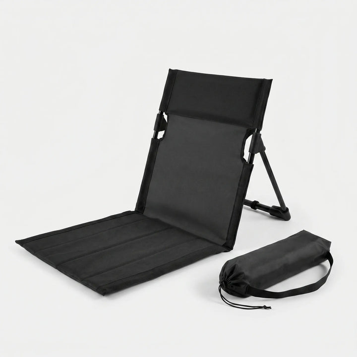 Compact folding ground chair, great for concerts or sports. Unisex portable outdoor seat for comfy stadium viewing.