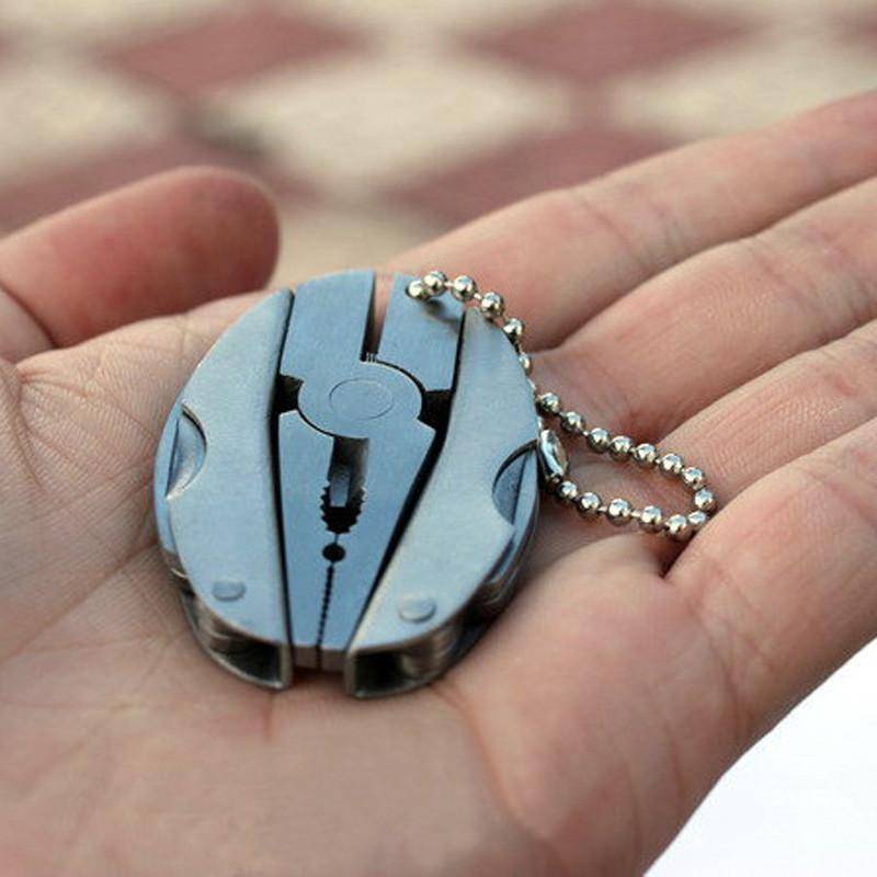 Compact outdoor gear: folding plier tool with multiple functions, ideal for survival kits