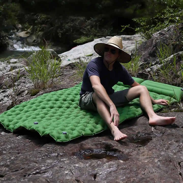 Portable air mattress for camping and hiking, ensuring a restful outdoor sleep experience