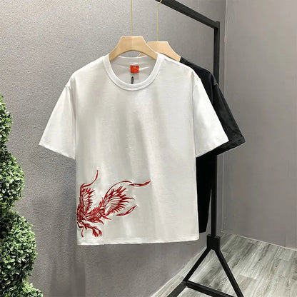 White unisex t-shirt featuring a stylish phoenix embroidery. Premium cotton graphic tee for comfort.