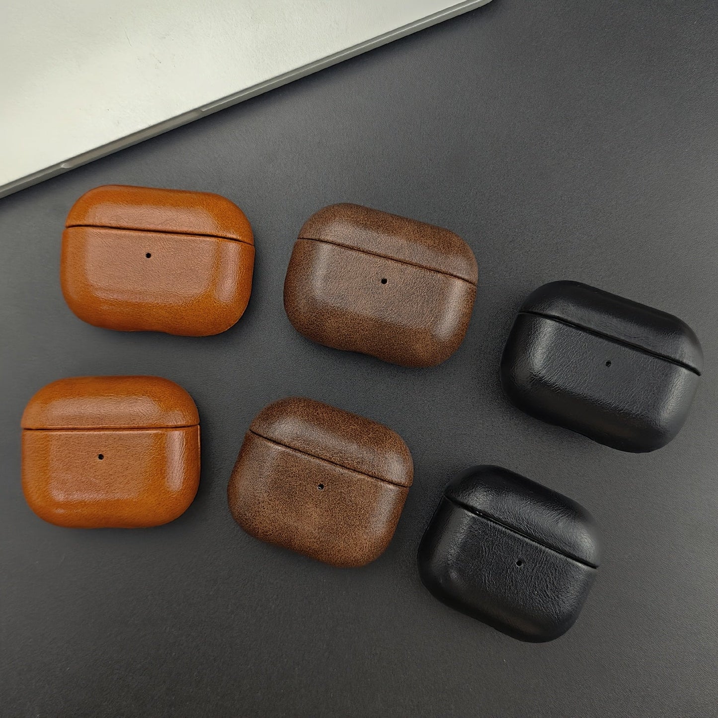 Premium leather earbud case, unisex design. Provides drop protection and scratch resistance for wireless earbuds.