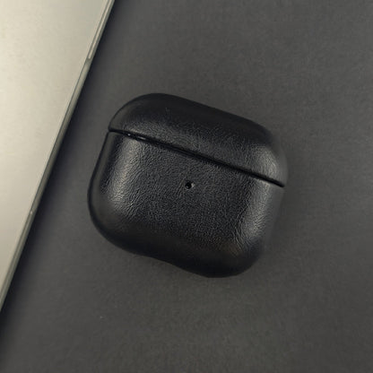 Elegant full-grain leather earphone accessory. Slim protective case for earbuds with wireless charging support.