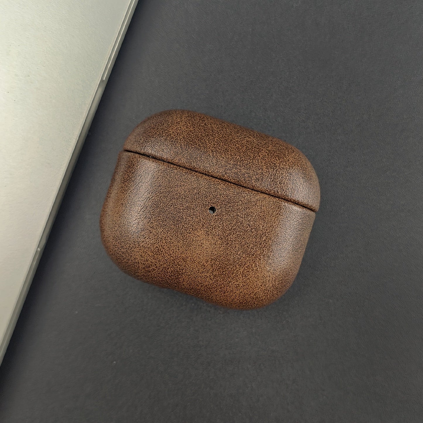 Unisex premium protective earbud case crafted from full-grain leather. Slim & durable tech accessory.