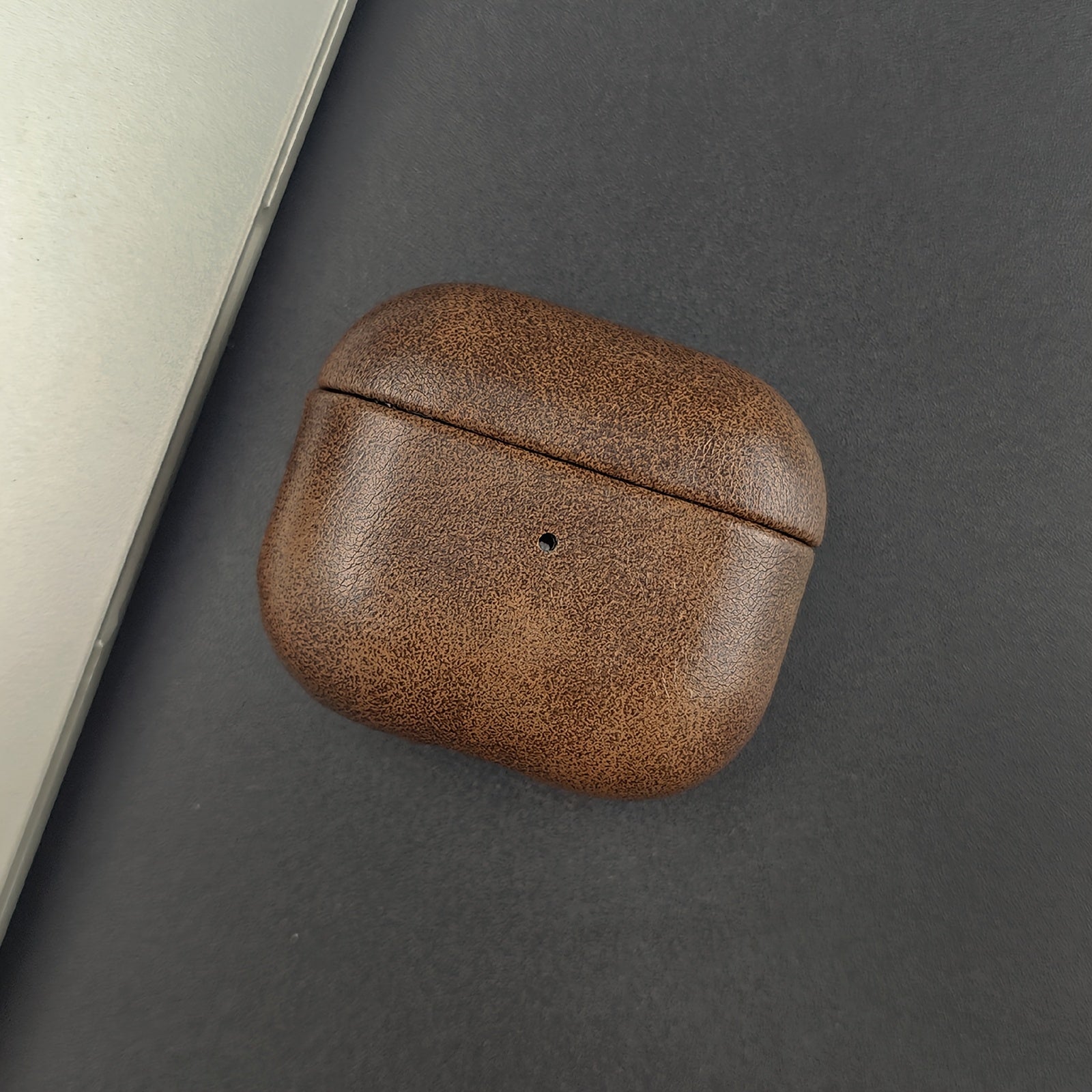 Unisex premium protective earbud case crafted from full-grain leather. Slim & durable tech accessory.