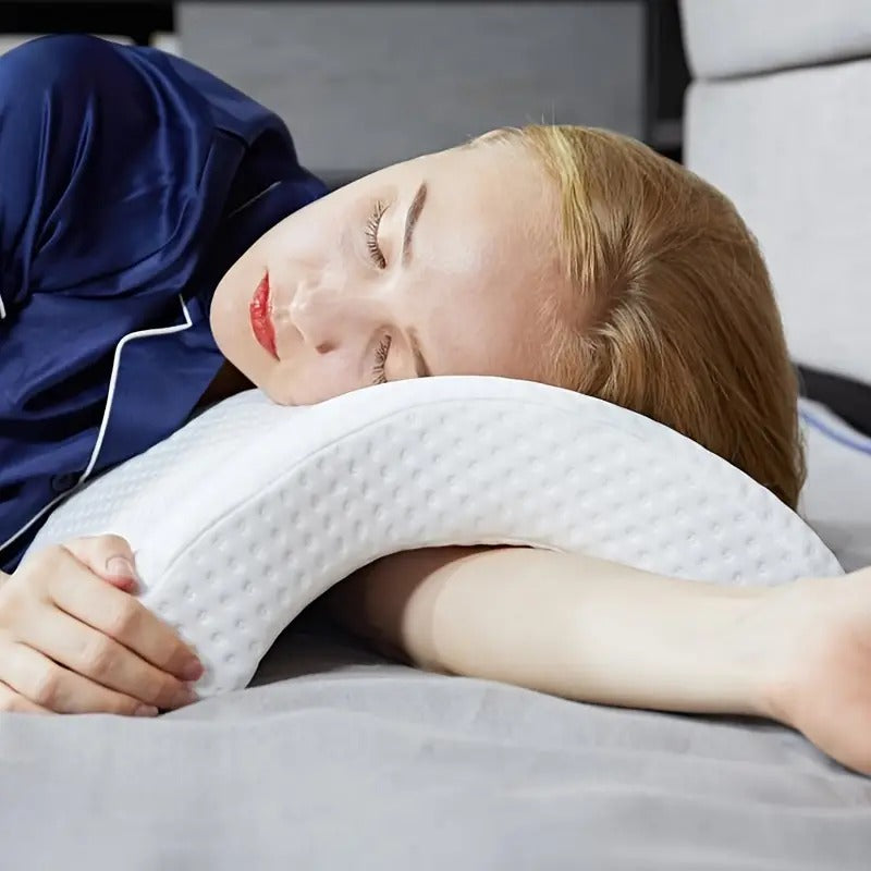 Comfortable Purely Curved memory foam nap pillow, perfect for resting and reducing neck strain.