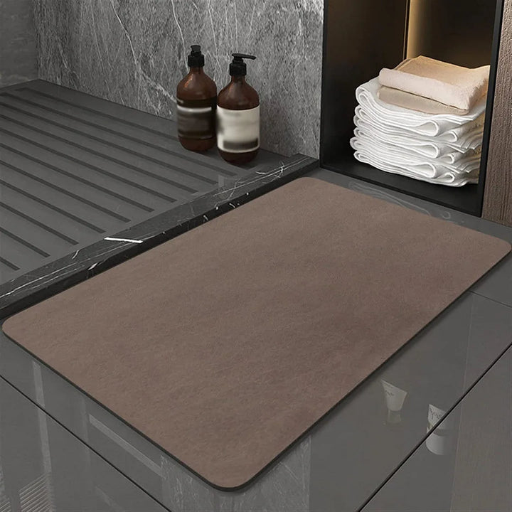 Highly absorbent quick-dry diatomite bath mat. Anti-slip floor mat for a safe, modern, and hygienic bathroom.