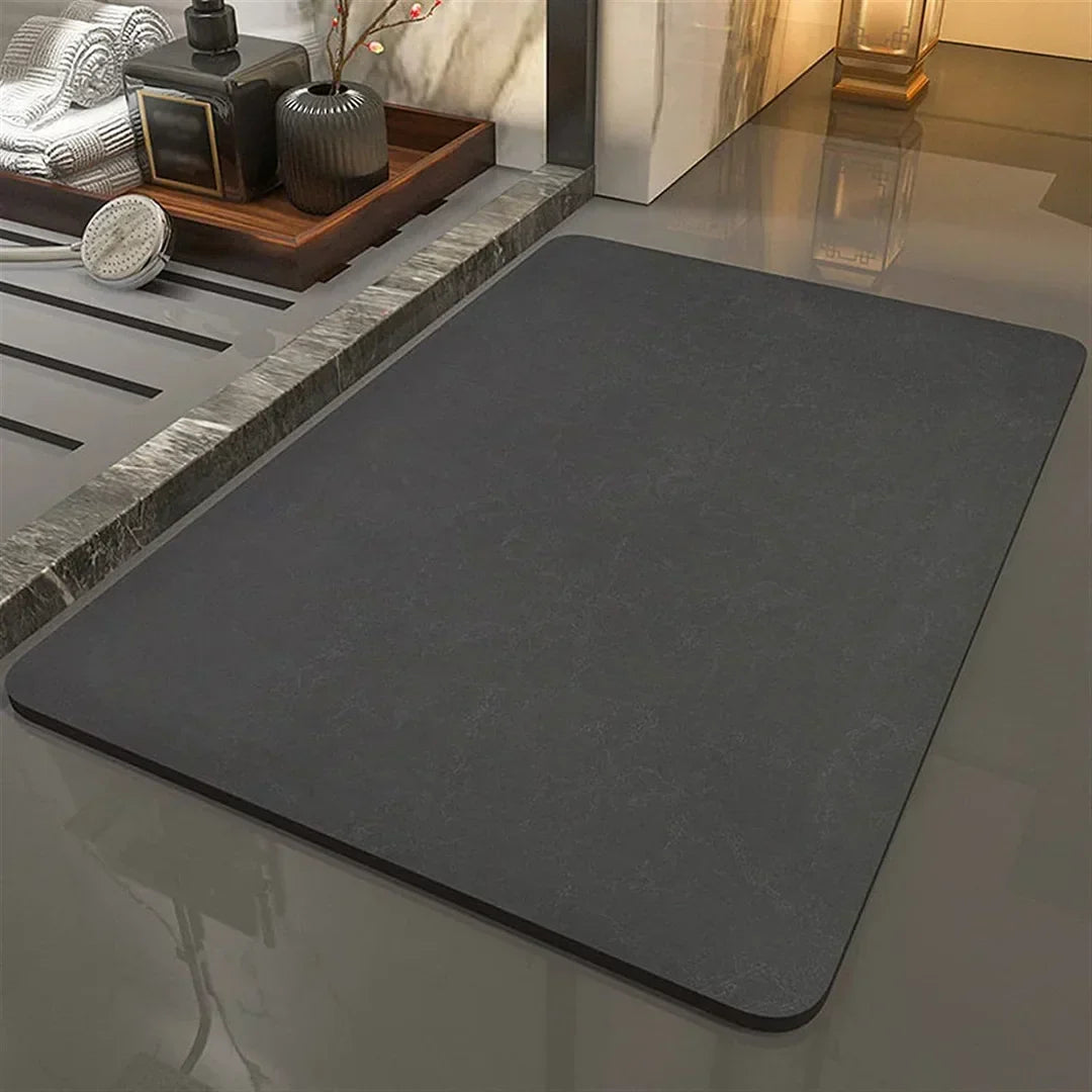 Secure anti-slip diatomite bath mat ensures safety in modern bathrooms. Quick-dry and eco-friendly floor solution.