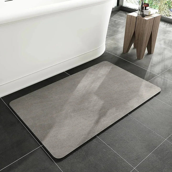 Natural eco-friendly diatomite bath mat. Quick-dry and anti-slip design for a sustainable modern bathroom.