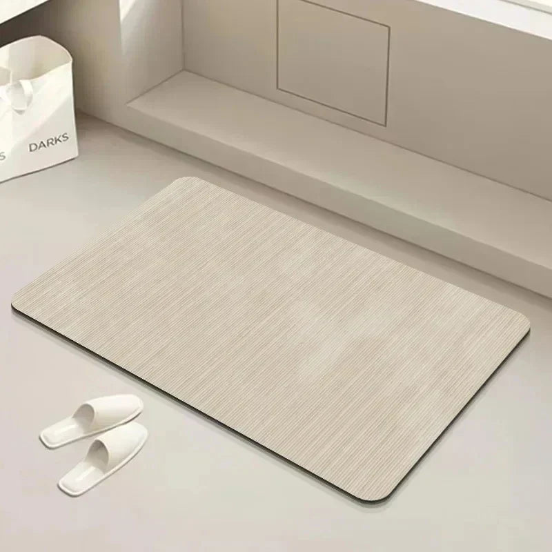 Absorbent quick-dry diatomite floor mat with anti-slip grip. Ideal for a clean, modern, and functional bathroom.