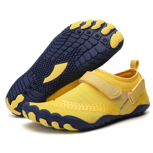 Unisex quick-dry water shoes by the lake, ready for boating, swimming, and outdoor summer fun.