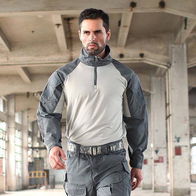Model comfortably wearing the Unisex Rapid Assault Quarter-Zip Shirt, ideal outdoor apparel for men and women
