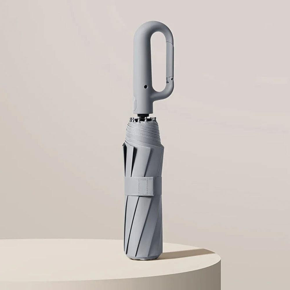 Portable & durable travel umbrella. Lightweight, windproof, UV protected, and automatic for easy carrying.