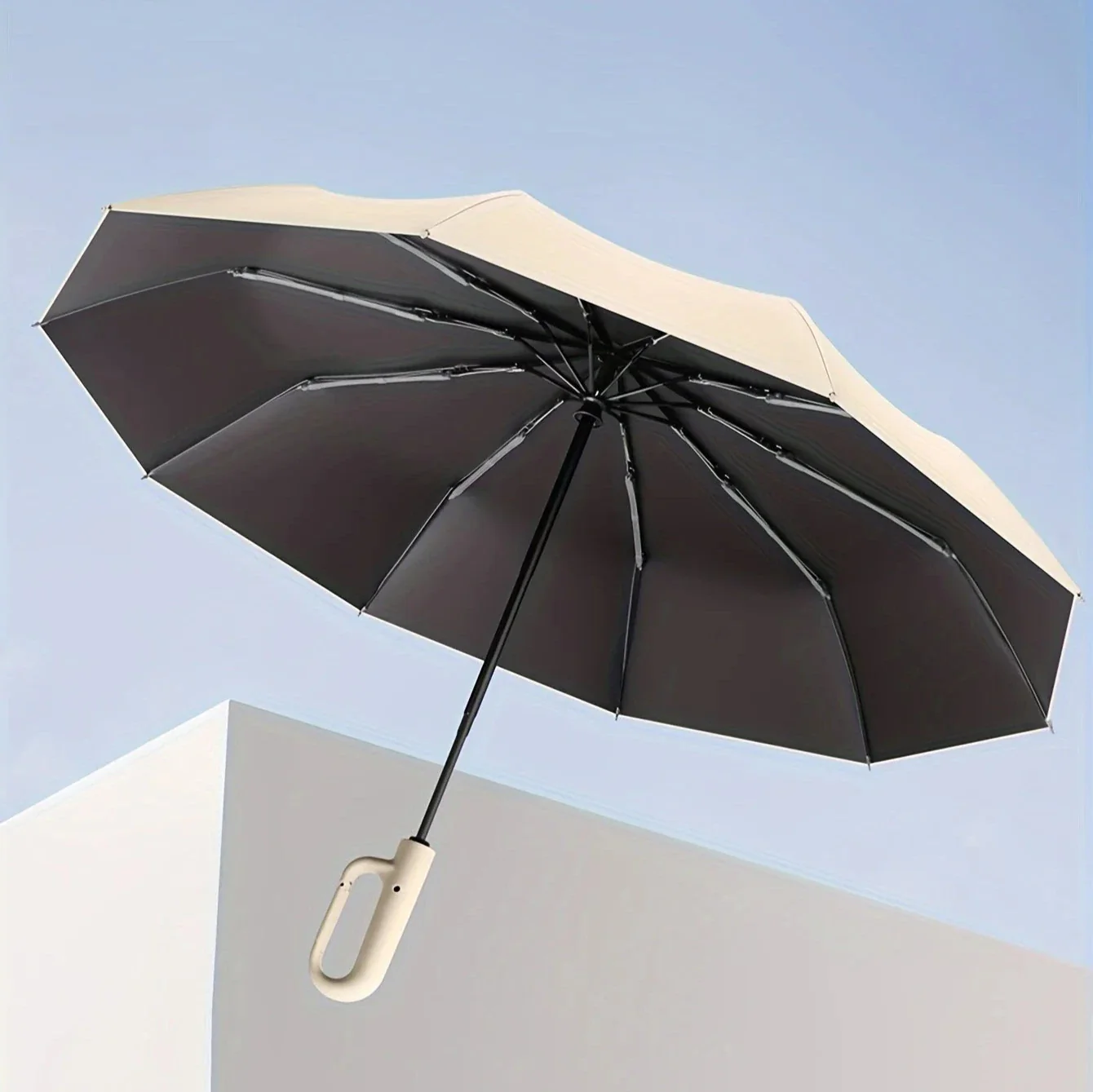 Stylish unisex compact travel umbrella. Durable, windproof, UV protective, and automatic for ultimate convenience.