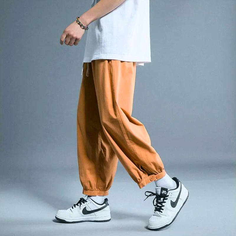 Unisex relaxed fit casual drawstring pants with elastic cuff for ultimate comfort and everyday wear.