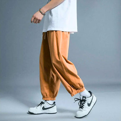 Unisex relaxed fit casual drawstring pants with elastic cuff for ultimate comfort and everyday wear.